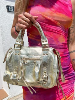 Bolso hebillas piel brillos dorado