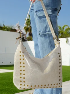 Bolso tachuelas brillos beige