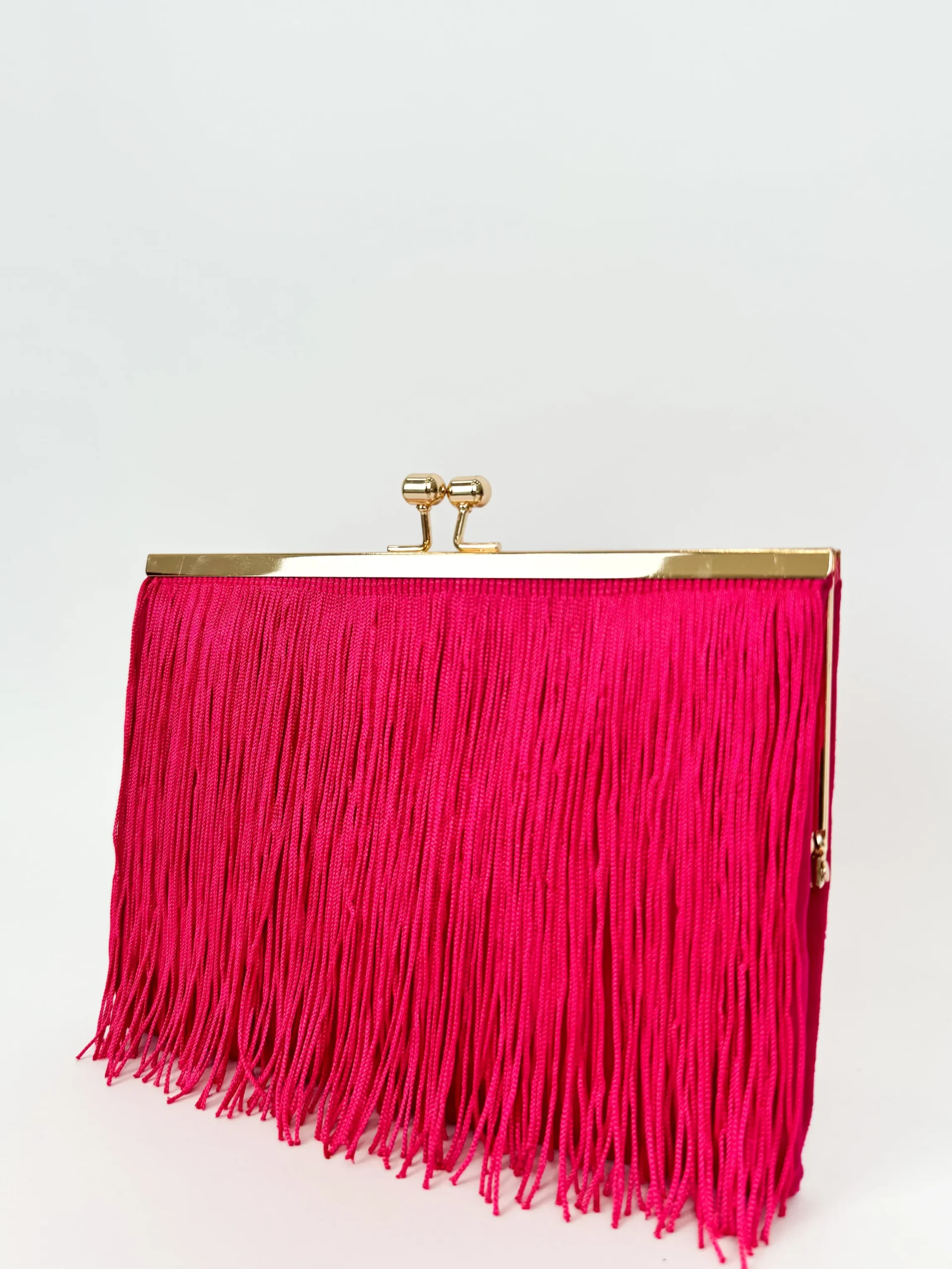 Clutch ante flecos fucsia